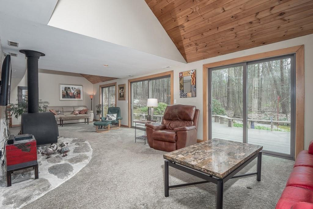 25 Hog Hill Road Pepperell, MA 01463 - Photo 6 of 34 a living room with furniture and a floor to ceiling window