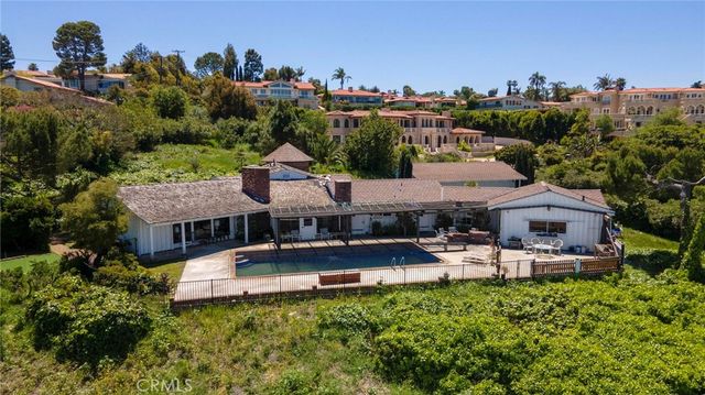 a living room with furniture a fireplace and a table