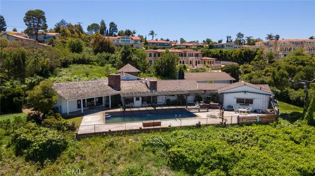 a living room with furniture a fireplace and a table