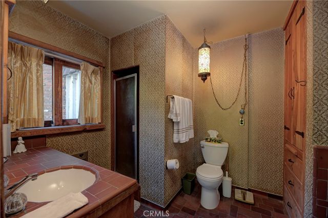 a front view of a house with a yard and a garage