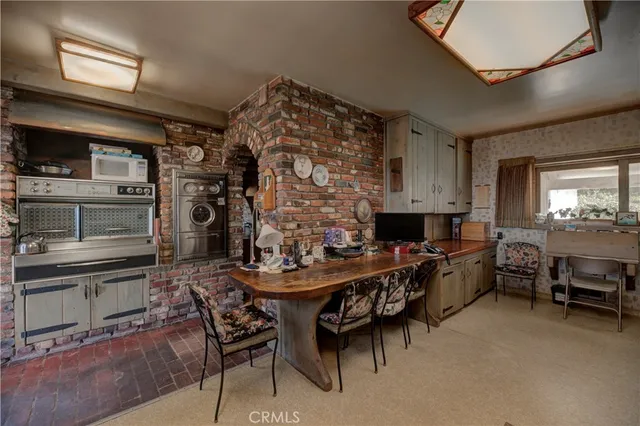 an aerial view of a house with a garden