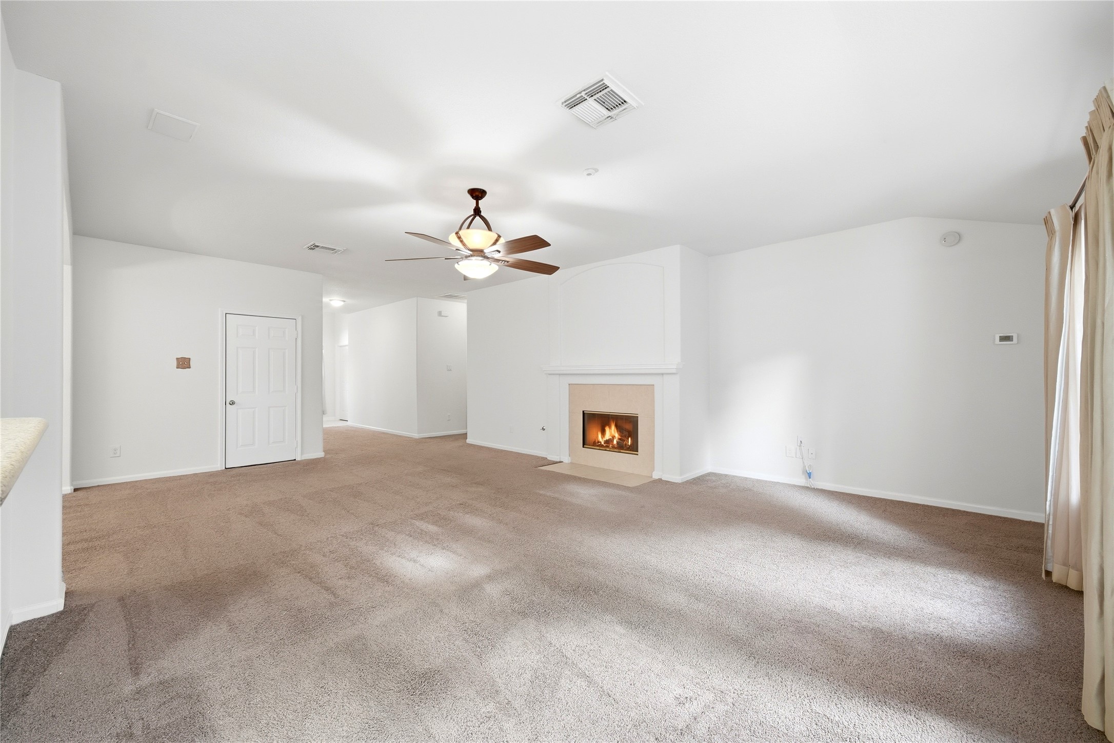 5411 Gate Canyon Court Spring, TX 77373 - Photo 10 of 33 a view of an empty room with a chandelier fan