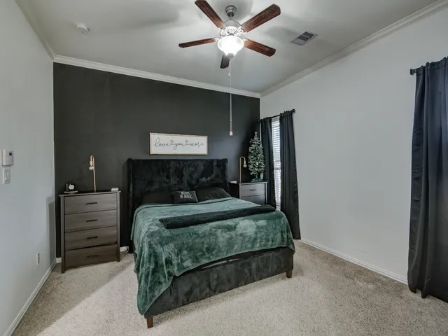 a bathroom with a granite countertop sink a large mirror and a bathtub