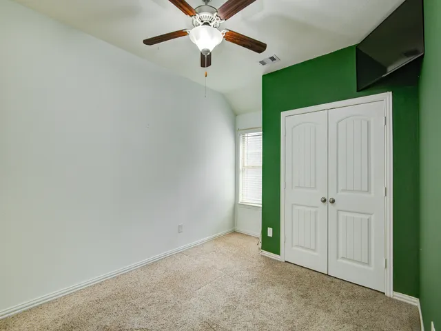 a view of a livingroom with a flat screen tv
