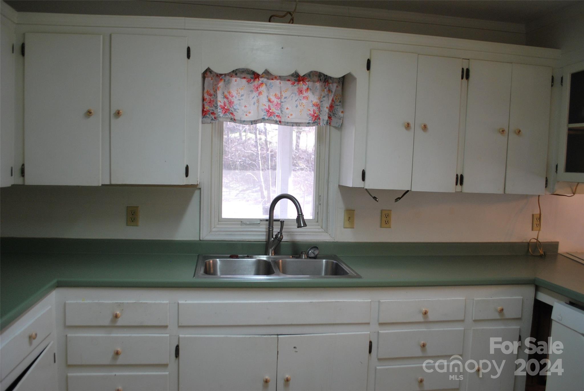 466 Mundy Field Road Canton, NC 28716 - Photo 6 of 20 a kitchen with white cabinets and a sink