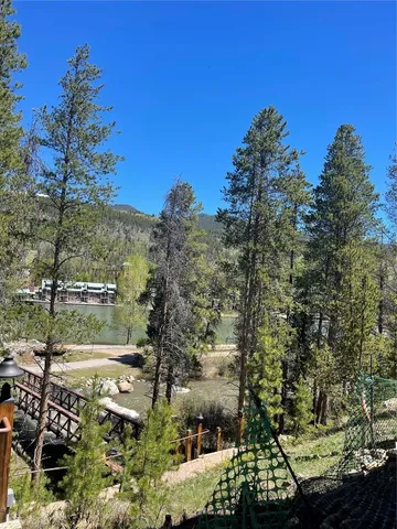 a view of a lake with a house in the background