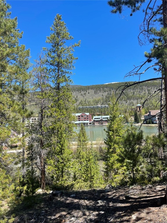 125 Lake Ridge Circle, Unit 1866 Keystone, CO 80435 - Photo 22 of 43 a view of a lake with a house in the background