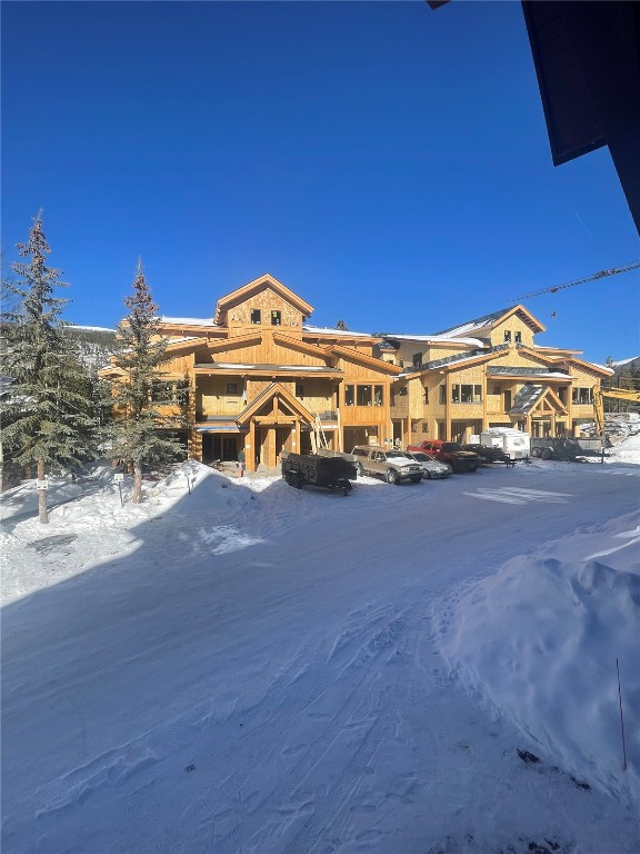 125 Lake Ridge Circle, Unit 1866 Keystone, CO 80435 - Photo 4 of 43 a view of a large building with a big yard