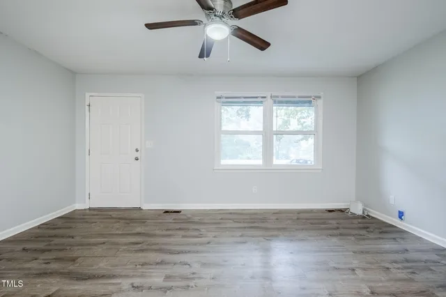 a kitchen with stainless steel appliances granite countertop a stove a sink dishwasher a refrigerator and a microwave