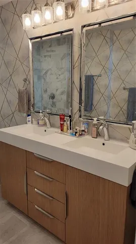 a view of walk in closet with clothes