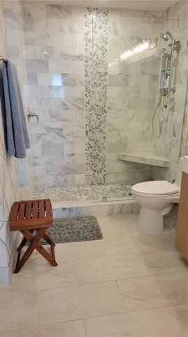 a room with lots of books and a baby crib