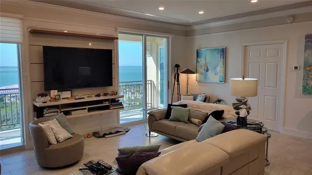 a living room with furniture rug and a large window