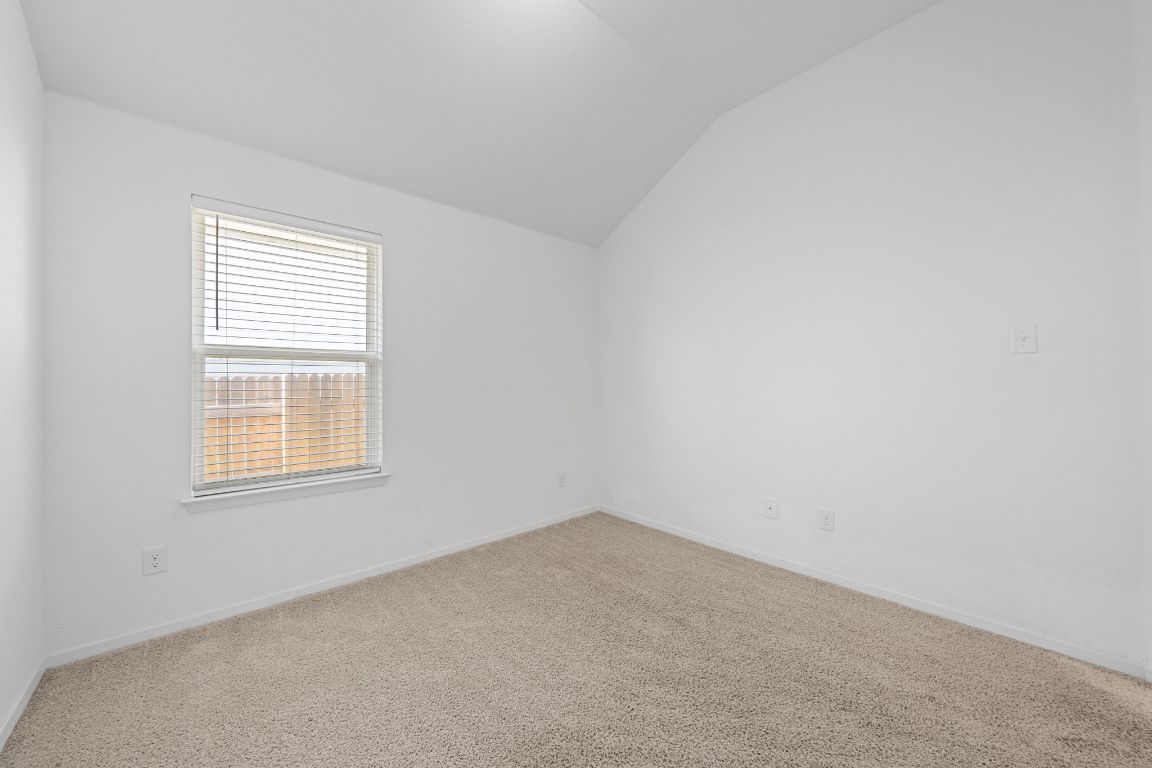 219 Trailside Lane Bastrop, TX 78602 - Photo 11 of 19 an empty room with a window