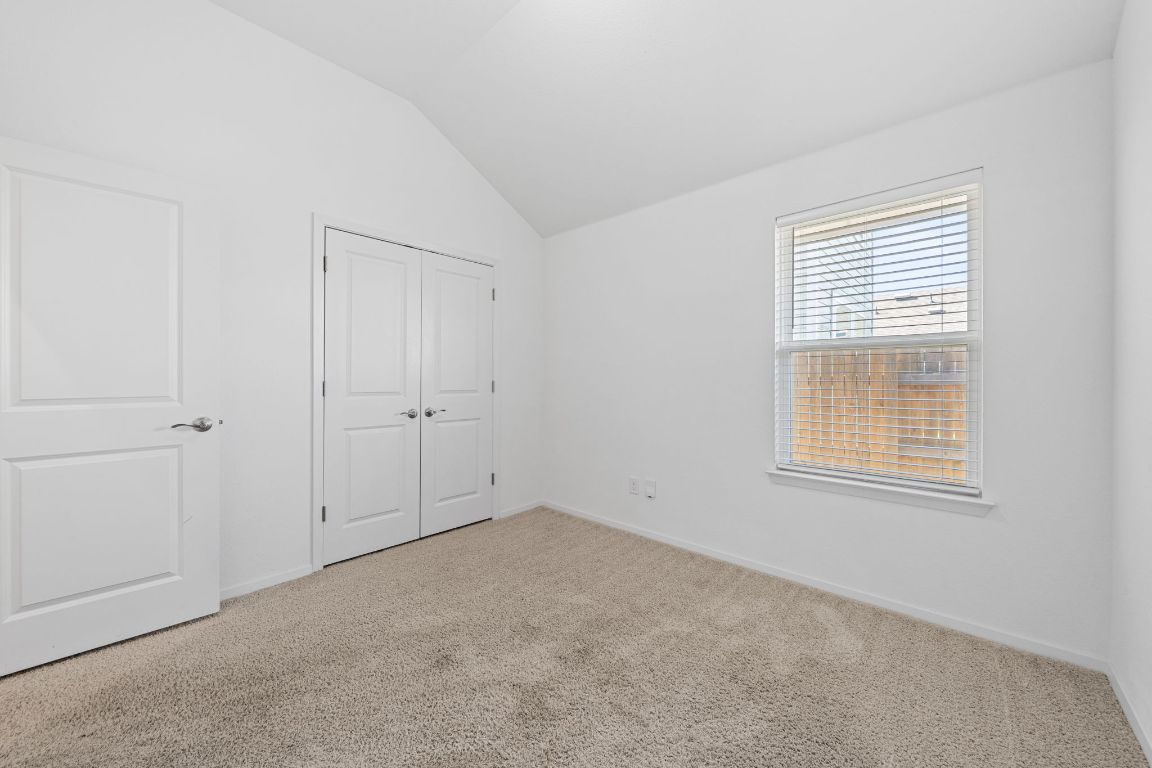 219 Trailside Lane Bastrop, TX 78602 - Photo 12 of 19 a view of an empty room with a window