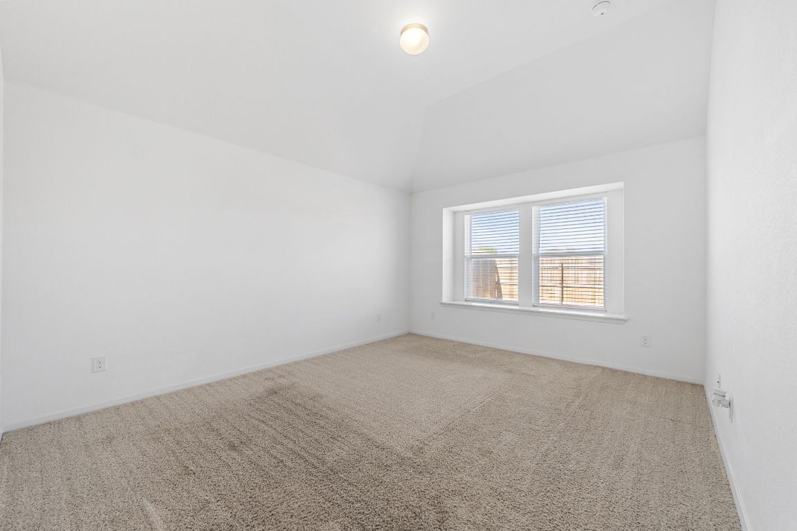 219 Trailside Lane Bastrop, TX 78602 - Photo 13 of 19 an empty room with a window