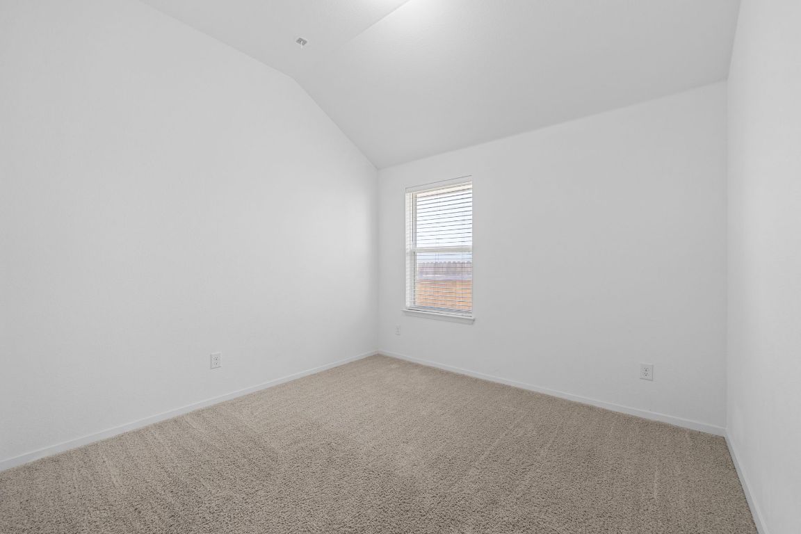 219 Trailside Lane Bastrop, TX 78602 - Photo 8 of 19 an empty room with a window