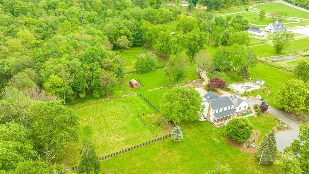6 Hitching Post Lane Wilbraham, MA 01095 - Photo 13 of 34 a view of a big yard with lots of green space and plants