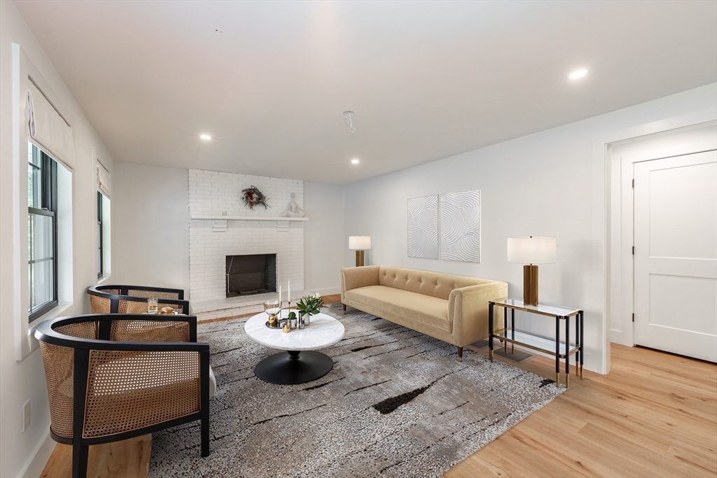 6 Hitching Post Lane Wilbraham, MA 01095 - Photo 16 of 34 a living room with furniture and a fireplace