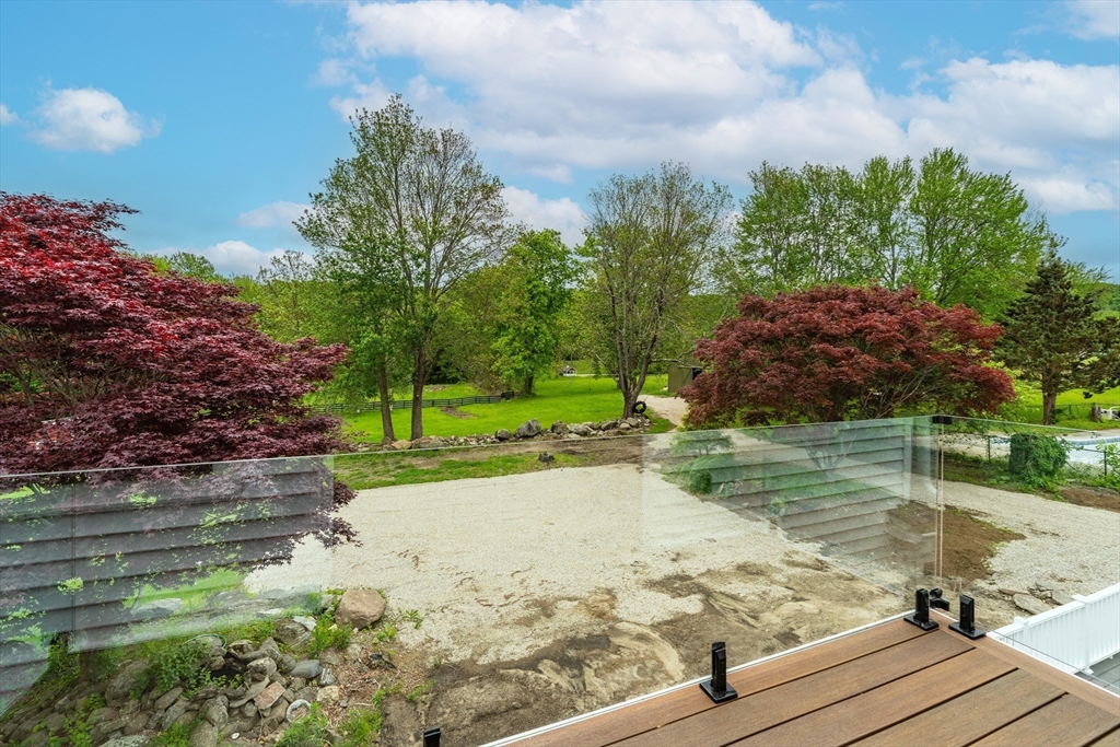 6 Hitching Post Lane Wilbraham, MA 01095 - Photo 20 of 34 a view of a lake with a house in the background