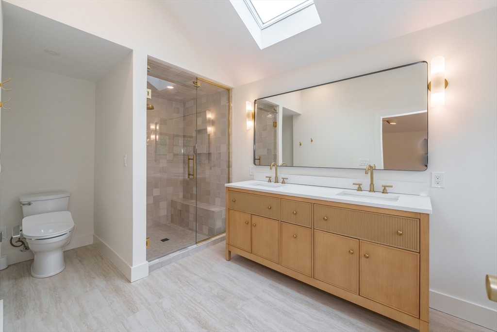 6 Hitching Post Lane Wilbraham, MA 01095 - Photo 22 of 34 a bathroom with a double vanity sink mirror and toilet
