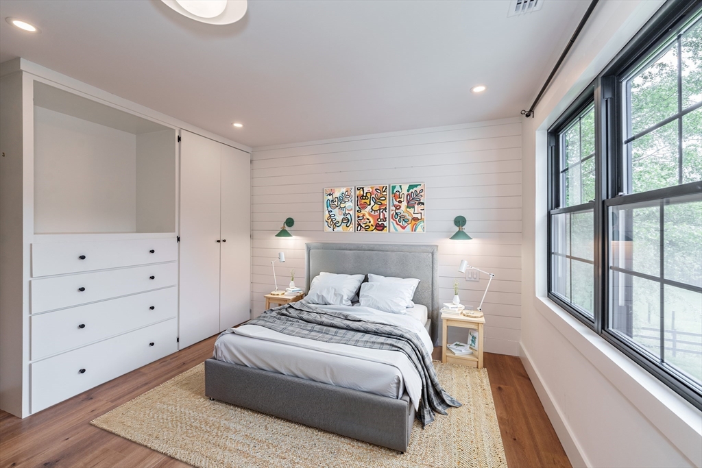 6 Hitching Post Lane Wilbraham, MA 01095 - Photo 27 of 34 a bedroom with a large bed and a large window