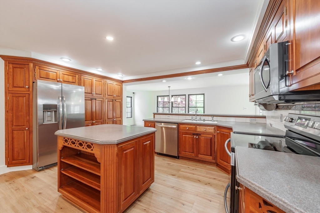 6 Hitching Post Lane Wilbraham, MA 01095 - Photo 30 of 34 a kitchen with stainless steel appliances granite countertop a stove and a sink