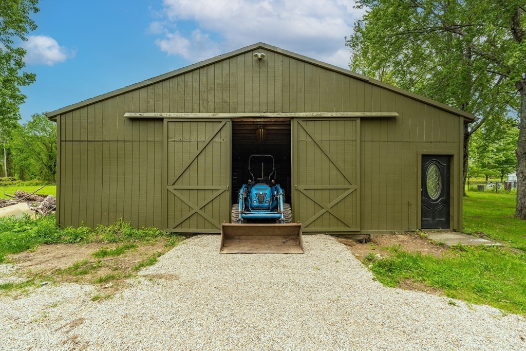 6 Hitching Post Lane Wilbraham, MA 01095 - Photo 3 of 34 a backyard of a house with plants and large tree