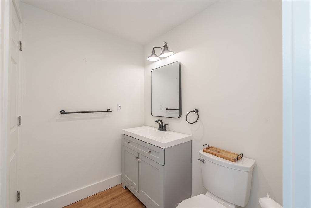 6 Hitching Post Lane Wilbraham, MA 01095 - Photo 33 of 34 a bathroom with a sink toilet vanity and mirror