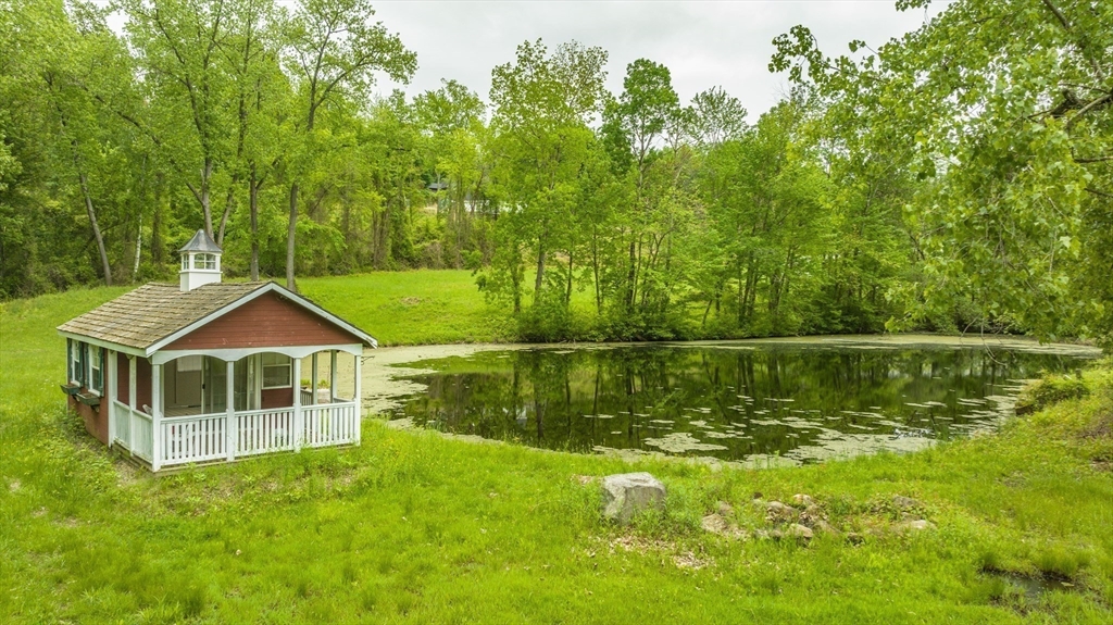 6 Hitching Post Lane Wilbraham, MA 01095 - Photo 6 of 34 a swimming pool with a garden