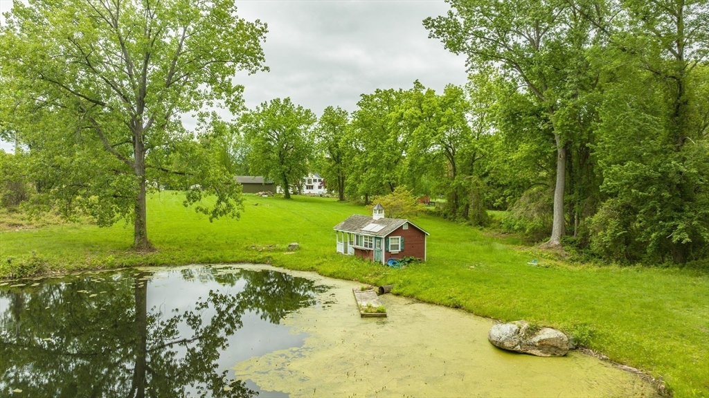 6 Hitching Post Lane Wilbraham, MA 01095 - Photo 10 of 34 a view of a golf course with a bench