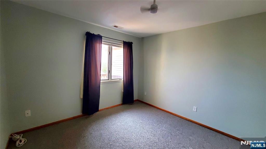 1159 Radio Road, Unit 7 Little Egg Harbor, NJ 08087 - Photo 13 of 38 an empty room with windows