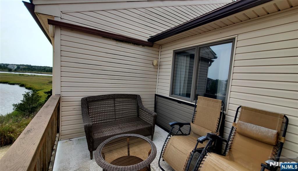 1159 Radio Road, Unit 7 Little Egg Harbor, NJ 08087 - Photo 17 of 38 a view of a patio with chairs and a stove top