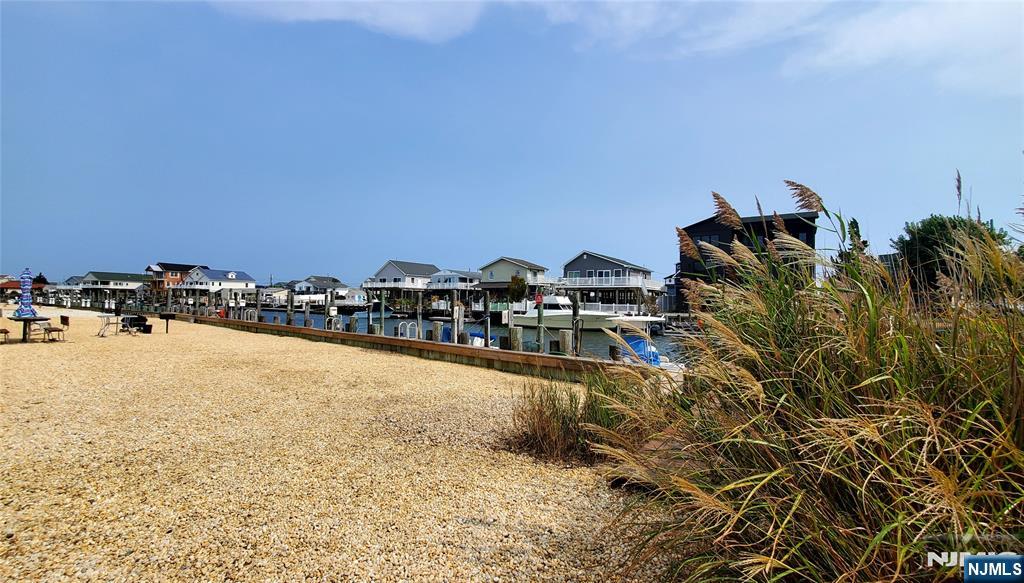 1159 Radio Road, Unit 7 Little Egg Harbor, NJ 08087 - Photo 20 of 38 a view of swimming pool yard and outdoor seating