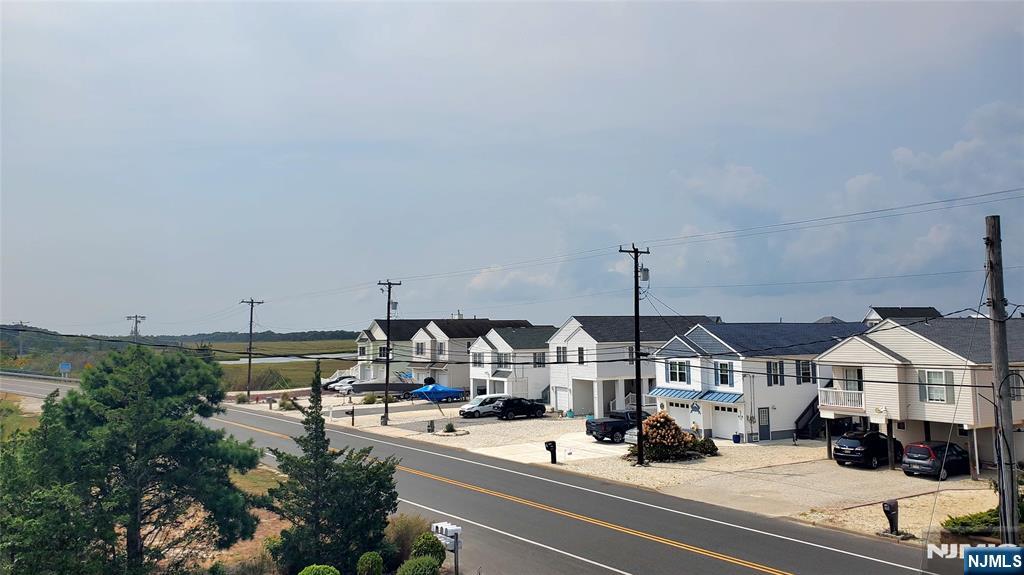 1159 Radio Road, Unit 7 Little Egg Harbor, NJ 08087 - Photo 2 of 38 a terrace with outdoor seating and city view