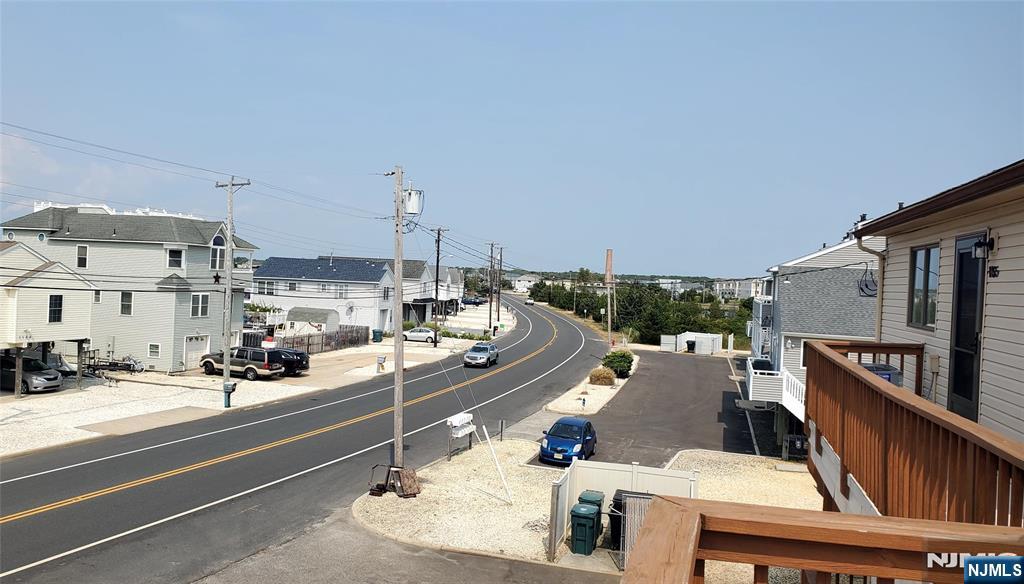 1159 Radio Road, Unit 7 Little Egg Harbor, NJ 08087 - Photo 2 of 38 a view of a patio with a table and chairs