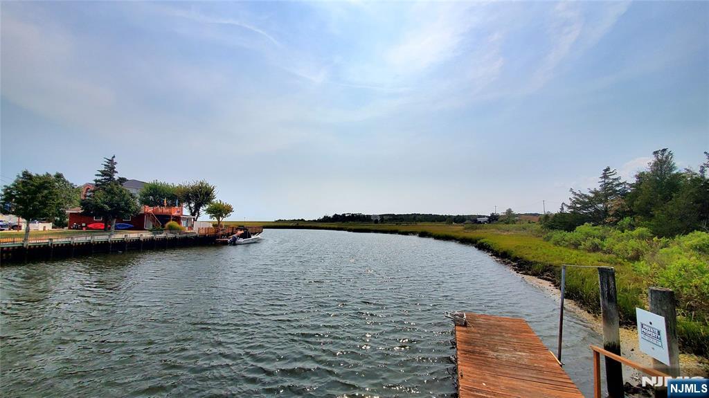 1159 Radio Road, Unit 7 Little Egg Harbor, NJ 08087 - Photo 23 of 38 a view of a lake with a car parked