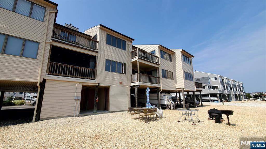 1159 Radio Road, Unit 7 Little Egg Harbor, NJ 08087 - Photo 26 of 38 a view of a building with a barbeque