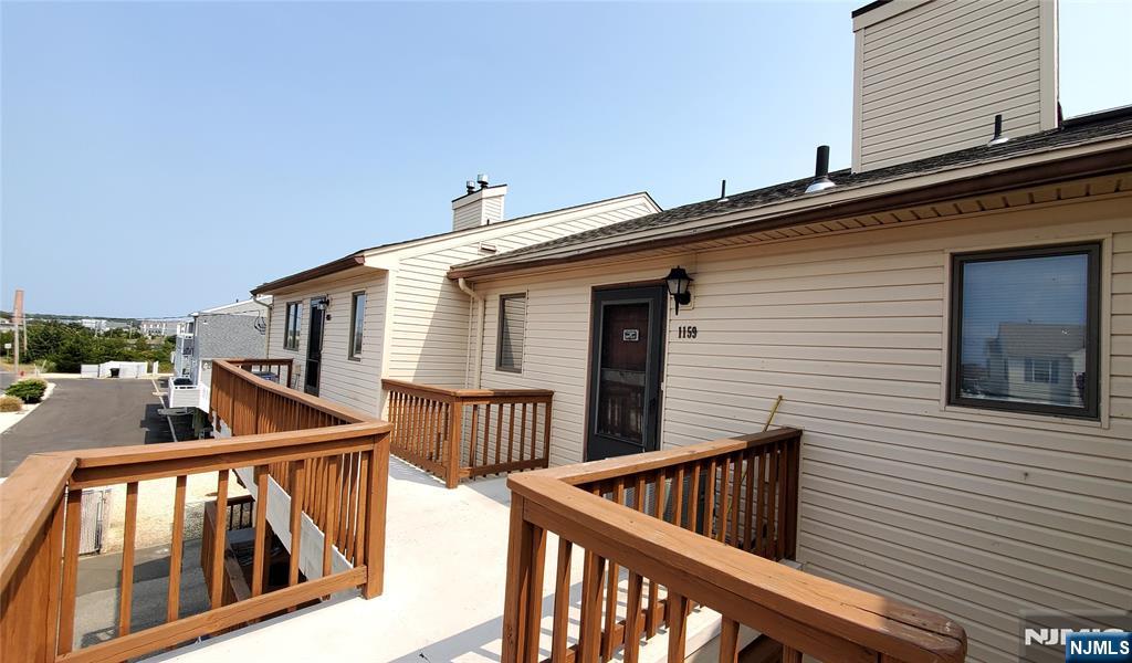 1159 Radio Road, Unit 7 Little Egg Harbor, NJ 08087 - Photo 3 of 38 a view of stairs and a balcony