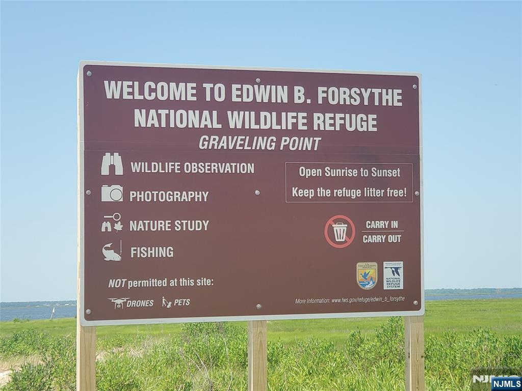 1159 Radio Road, Unit 7 Little Egg Harbor, NJ 08087 - Photo 31 of 38 a sign on the wall of a building