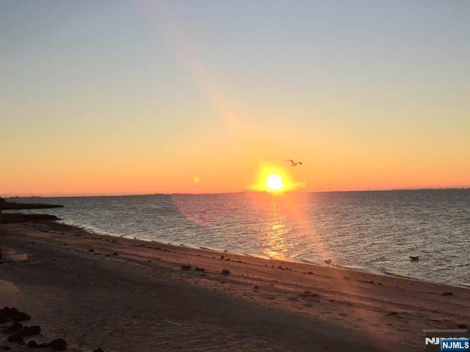 1159 Radio Road, Unit 7 Little Egg Harbor, NJ 08087 - Photo 33 of 38 a view of an ocean and beach