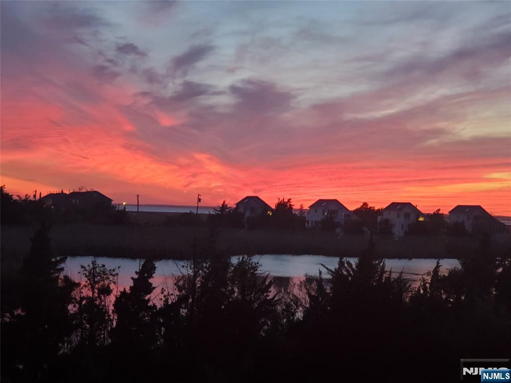 1159 Radio Road, Unit 7 Little Egg Harbor, NJ 08087 - Photo 33 of 38 a view of a lake with a mountain in the background