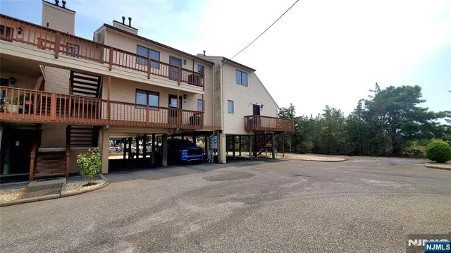 a kitchen with a sink a stove and cabinets
