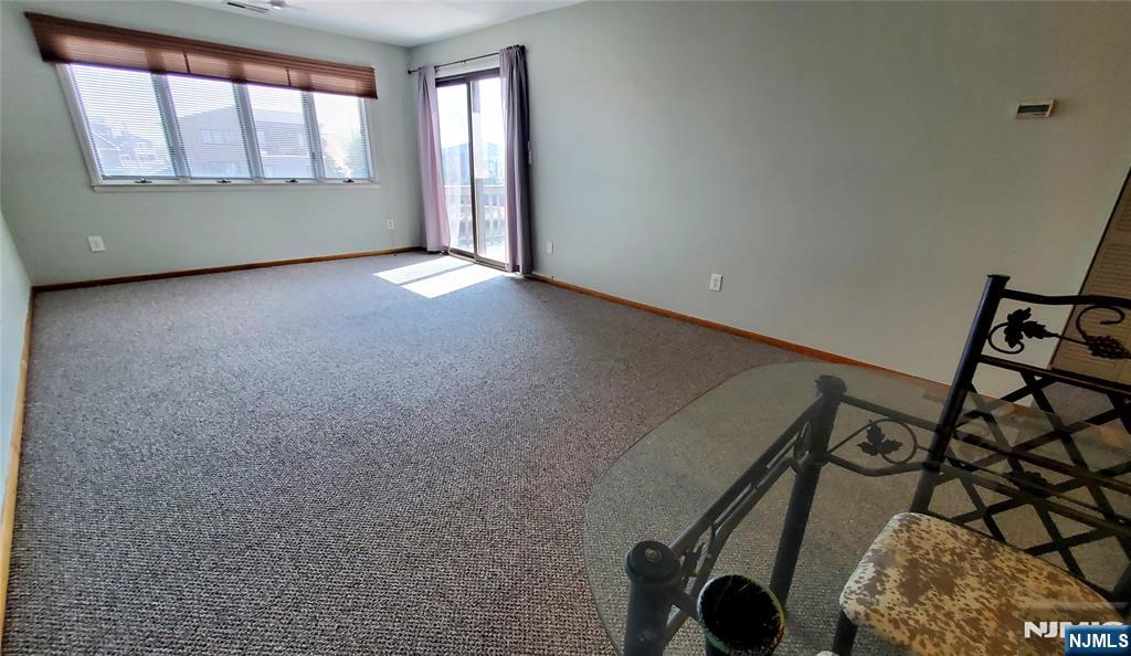 1159 Radio Road, Unit 7 Little Egg Harbor, NJ 08087 - Photo 10 of 38 an empty room with windows