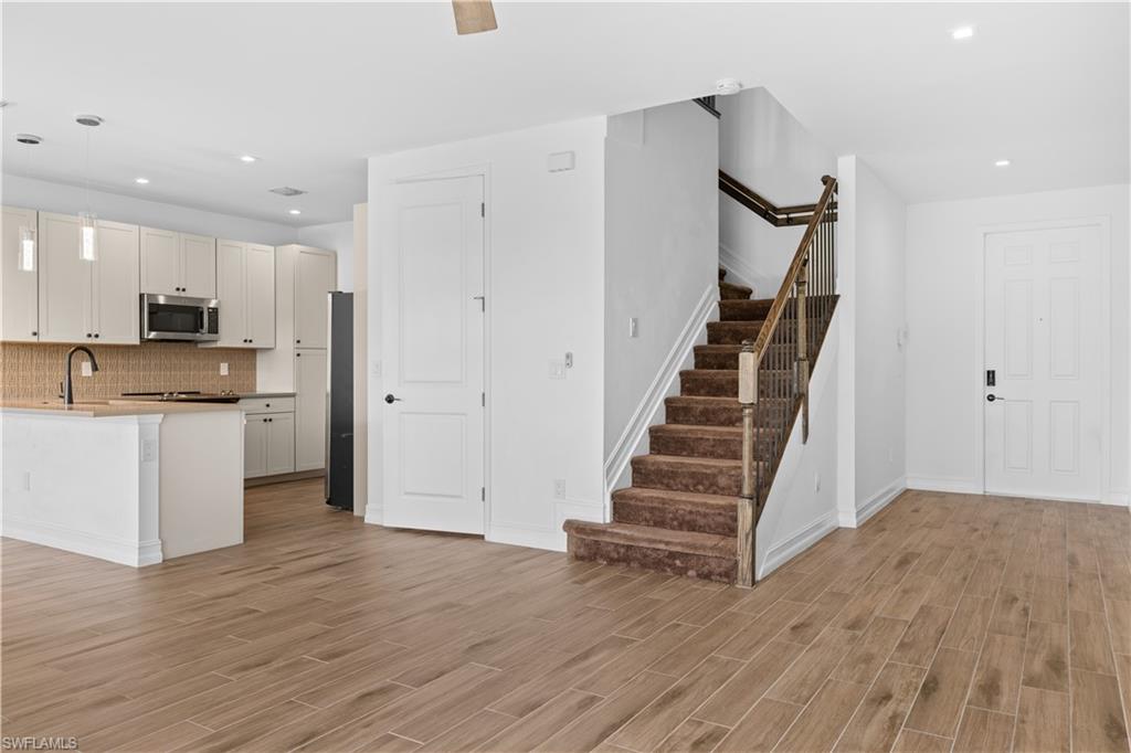 7548 Carnegie Way Naples, FL 34119 - Photo 7 of 20 Stairway to 2nd level
