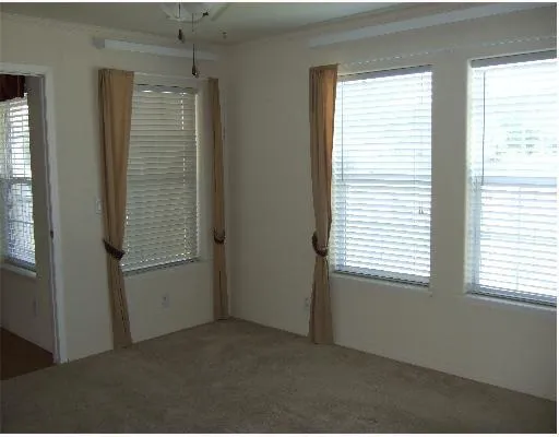 a view of empty room with windows