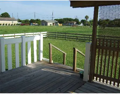 a view of a porch with a yard