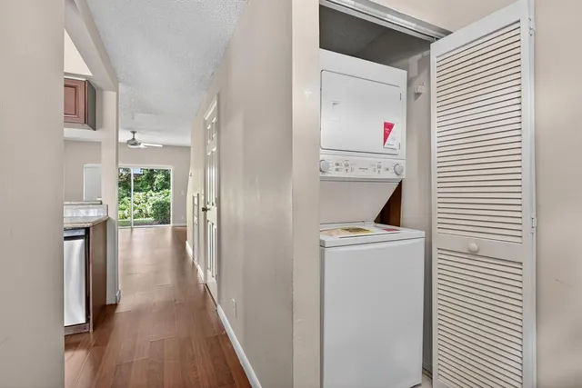 a view of hallway with wooden floor
