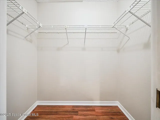 a view of a balcony with wooden floor