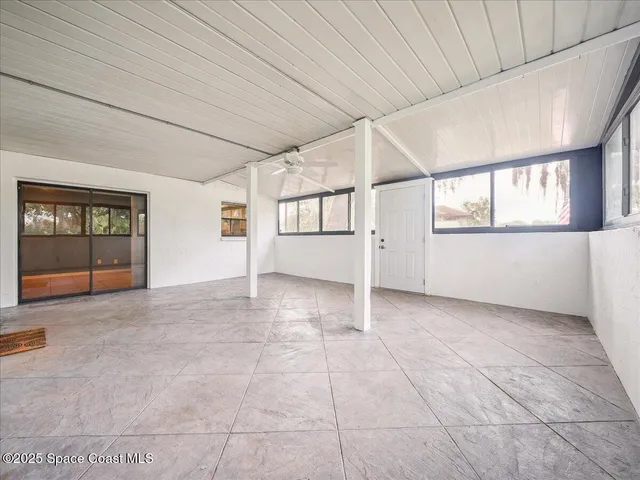 an empty room with windows