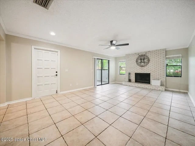 a spacious bedroom with a bed and a dresser